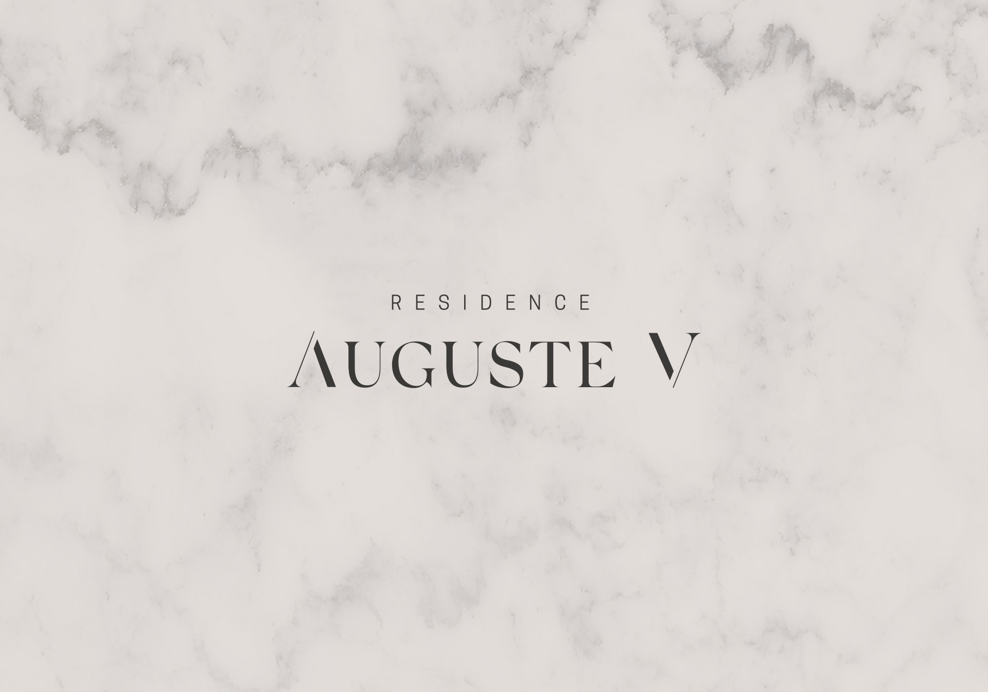 Auguste-V-logo-residence Essenzia Design Studio - Création graphique du logo d'une résidence avec typographie sérif